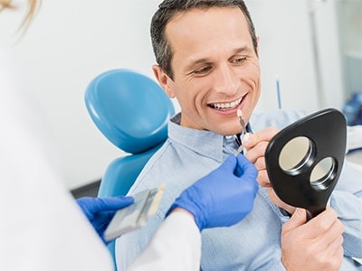 man choosing dental implant